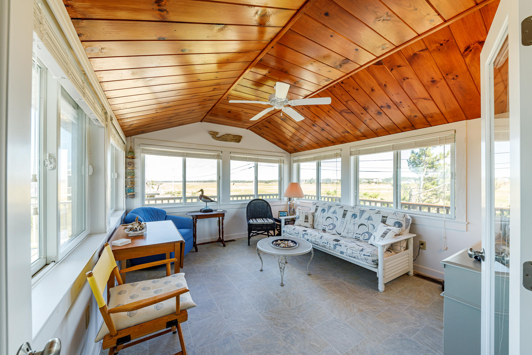 165 Harmes Way Eastham, MA 02642 - Photo 16 of 31 a bedroom with furniture and large windows
