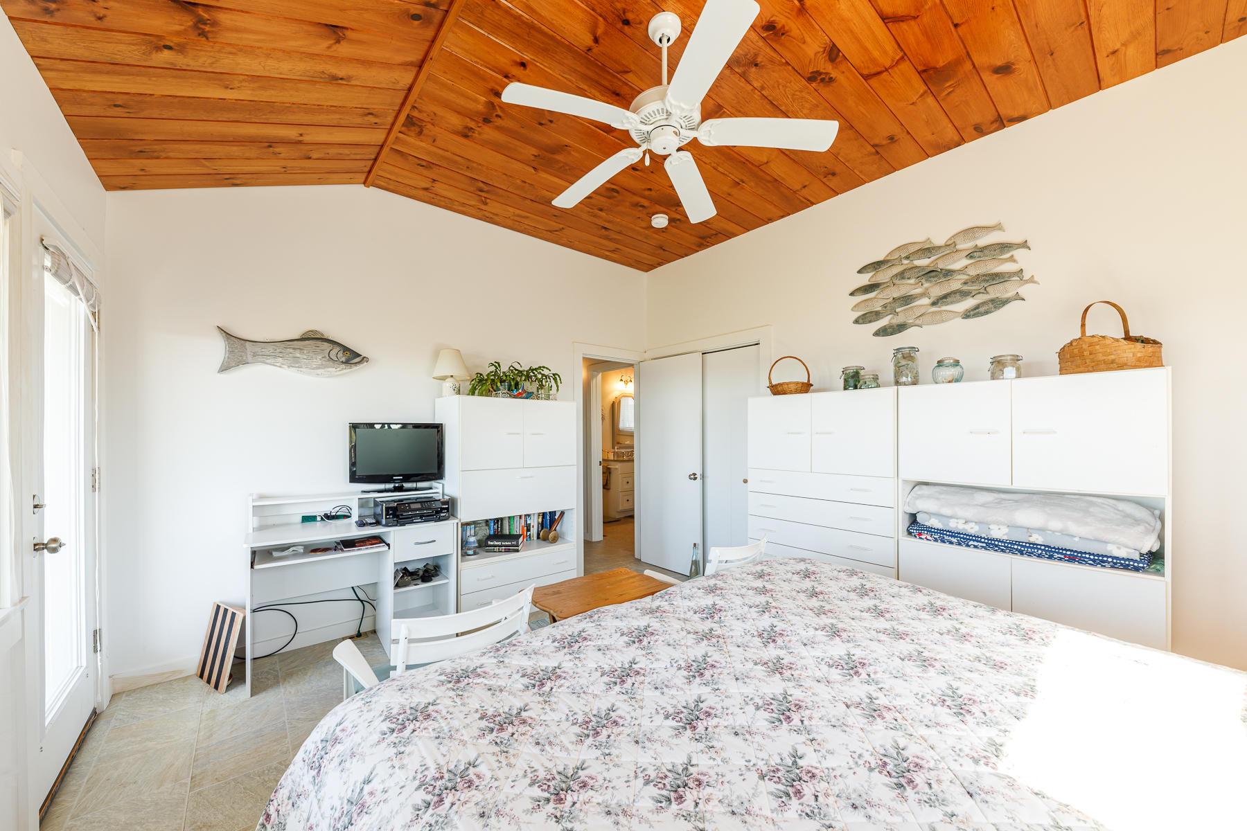 165 Harmes Way Eastham, MA 02642 - Photo 18 of 31 a bedroom with a bed and a flat screen tv