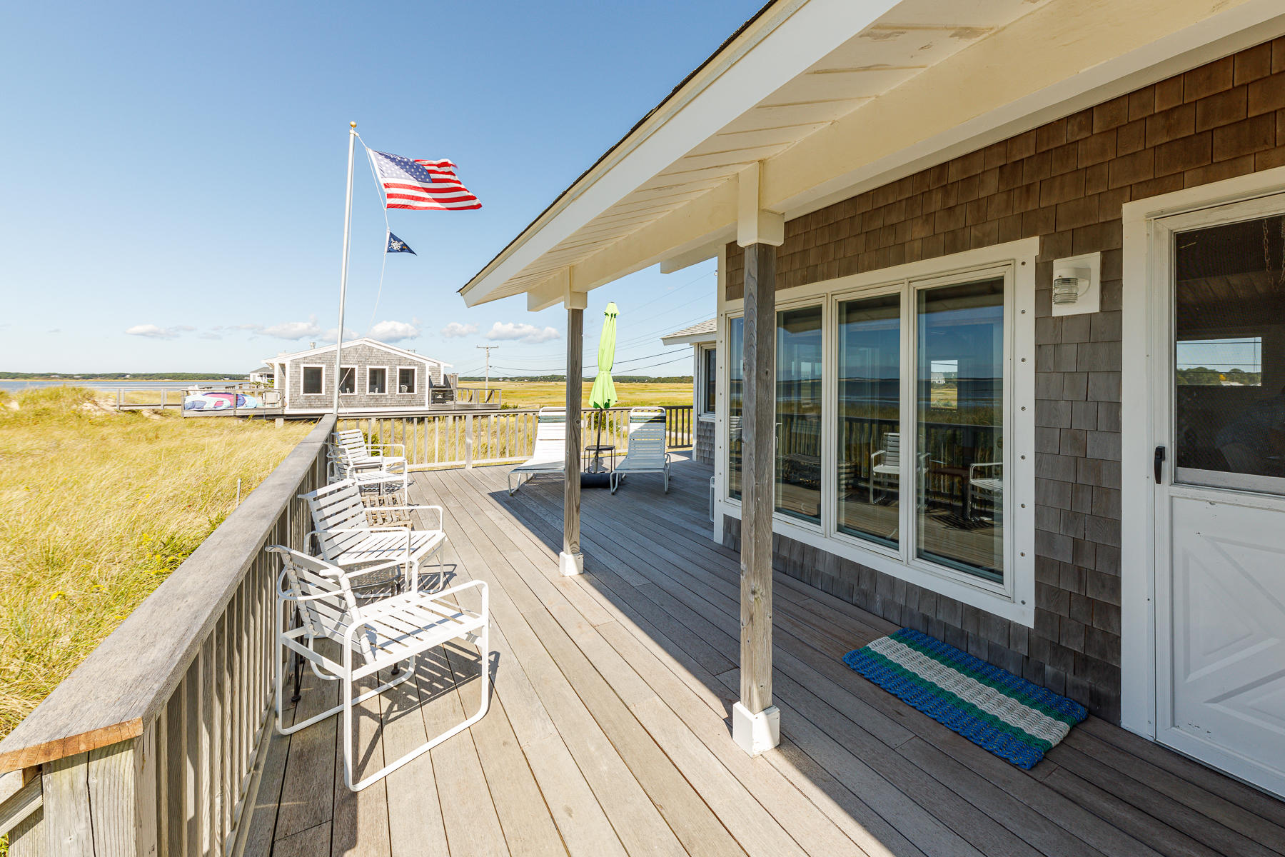 165 Harmes Way Eastham, MA 02642 - Photo 7 of 31 a view of a balcony with dining table and chairs