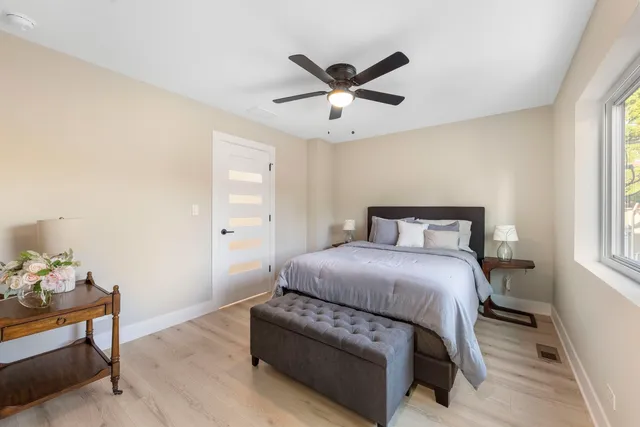 a bedroom with a bed and window