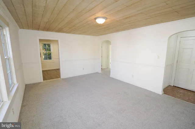a bathroom with a bathtub and a window
