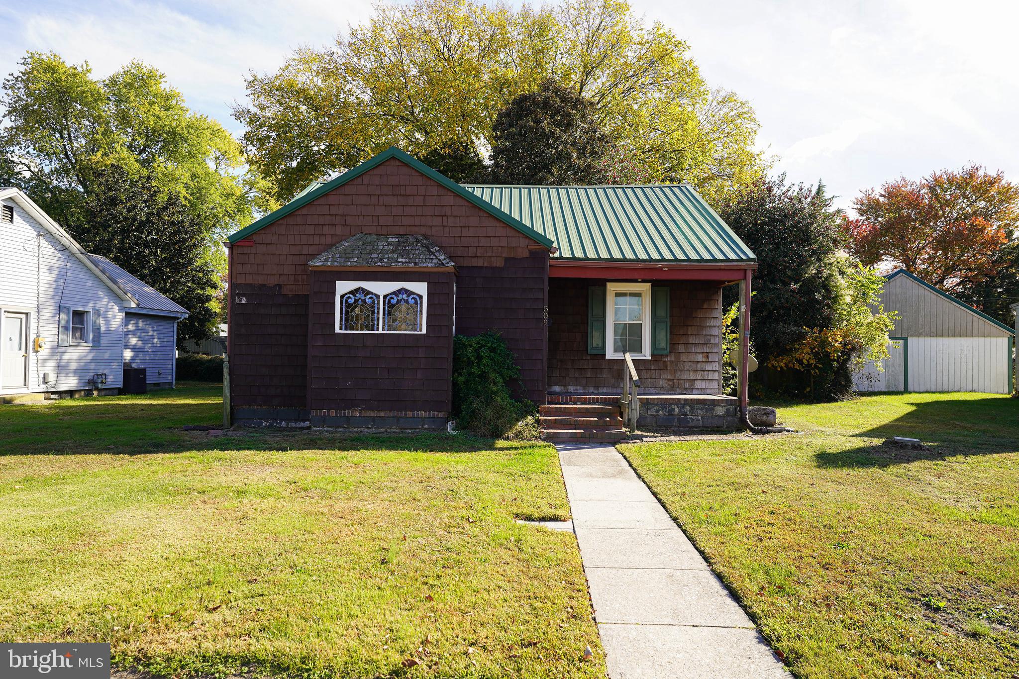 509 State Street Seaford, DE 19973 - Photo 2 of 31 a view of swimming pool with garden