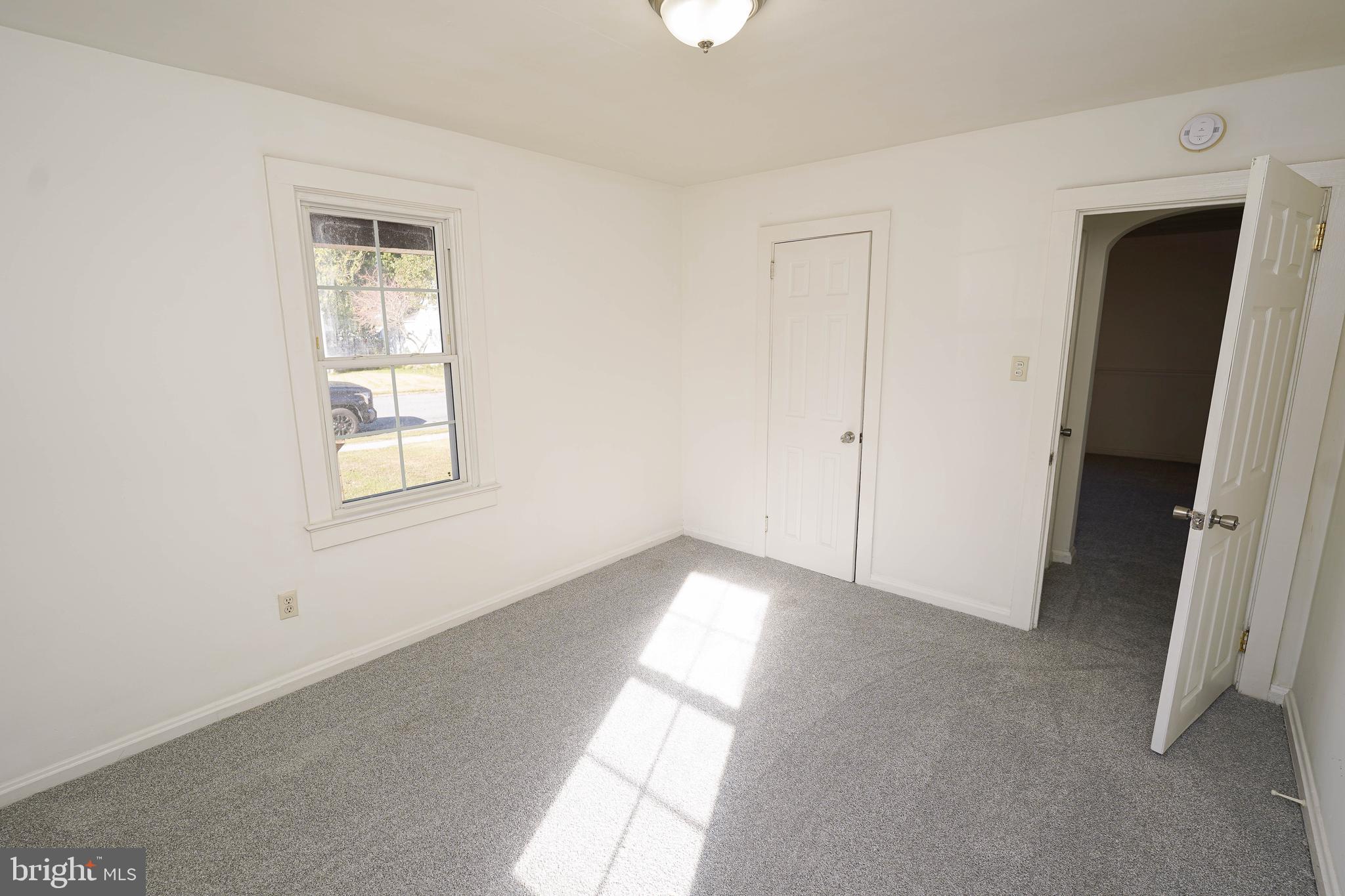509 State Street Seaford, DE 19973 - Photo 22 of 31 a view of empty room with windows