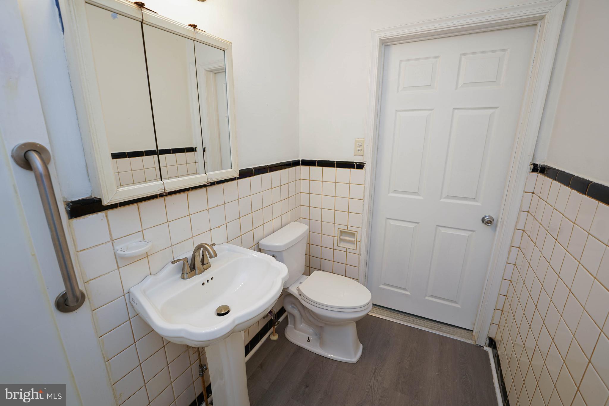 509 State Street Seaford, DE 19973 - Photo 25 of 31 a bathroom with a sink toilet and shower