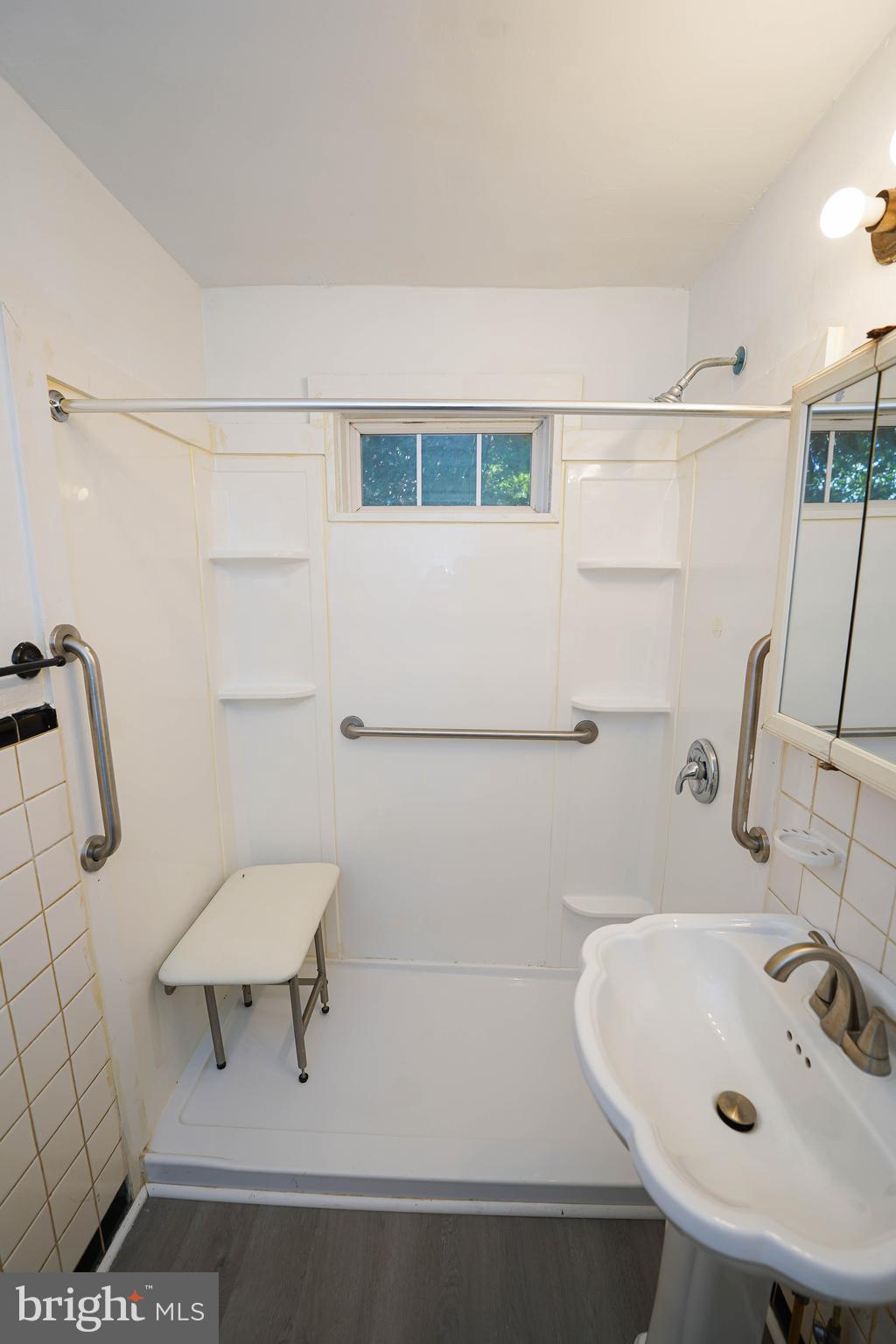 509 State Street Seaford, DE 19973 - Photo 26 of 31 a bathroom with a sink and a bathtub