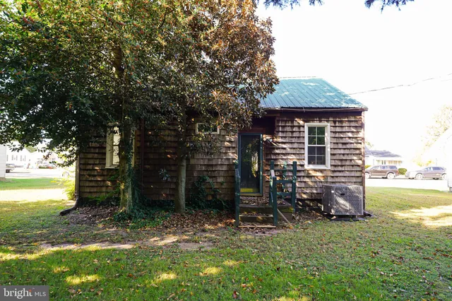 a backyard of a house with barbeque oven