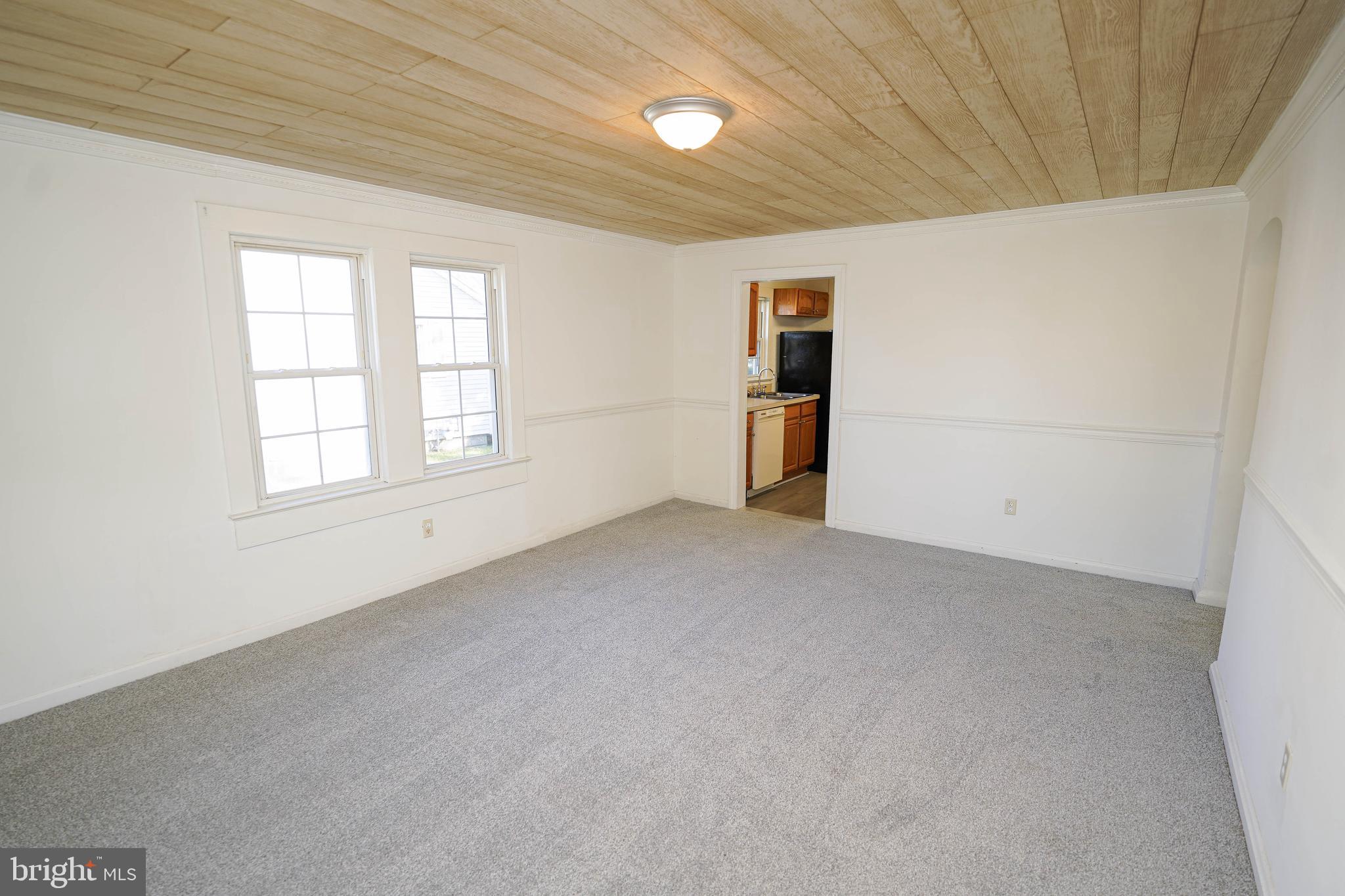 509 State Street Seaford, DE 19973 - Photo 10 of 31 an empty room with windows