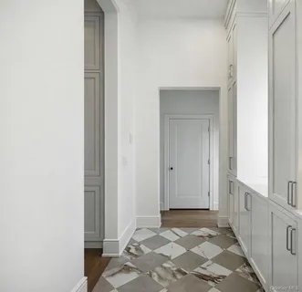 a view of livingroom with hardwood floor and a kitchen