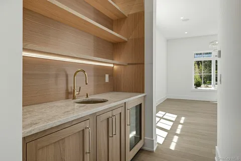 a view of a room with balcony and floor to ceiling windows