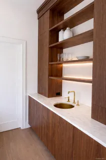 a bathroom with a tub shower and window