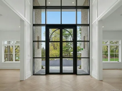 a view of livingroom with furniture fire place and windows