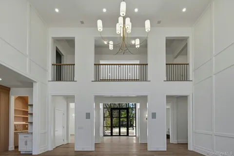 a bathroom with a sink vanity mirror and toilet