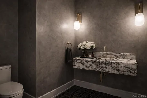 a kitchen with stainless steel appliances granite countertop a sink a stove and a wooden floors