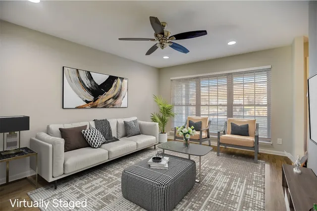 a living room with furniture and a large window