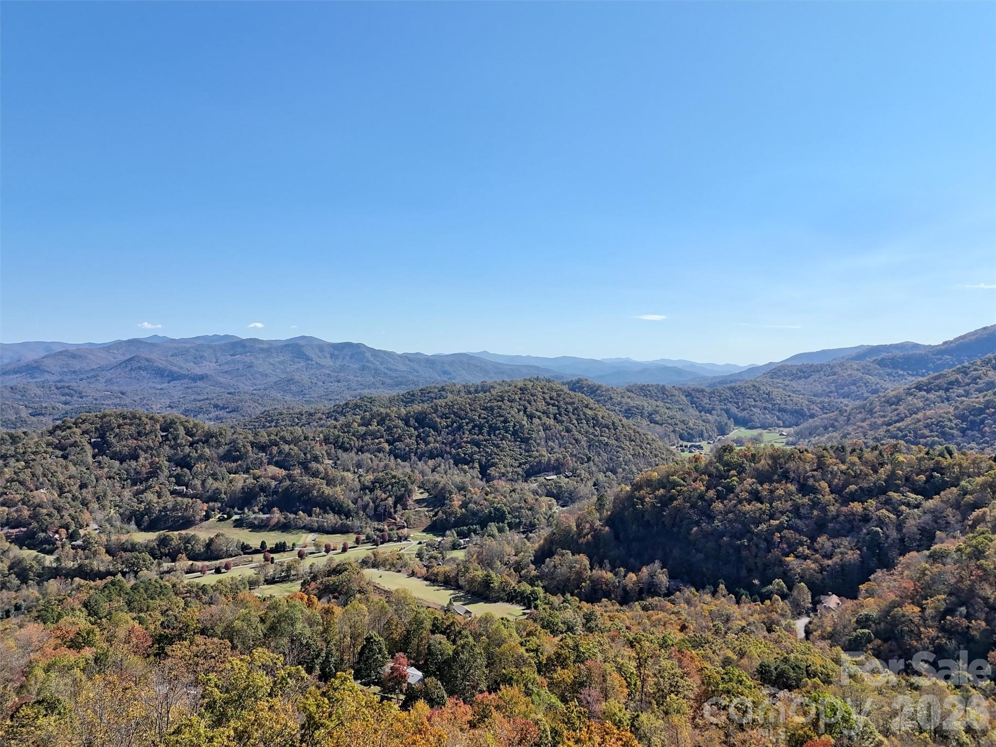 an aerial view of residential house and green space