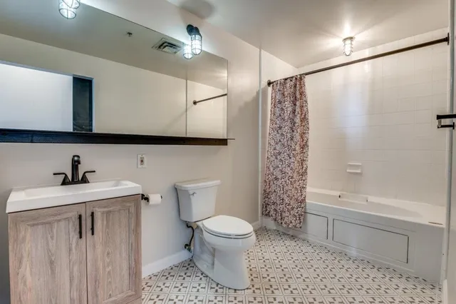 a bathroom with a sink a toilet and a bathtub