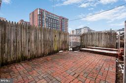 1112 3rd Street Northeast Washington, DC 20002 - Photo 15 of 16 a view of a building with wooden fence