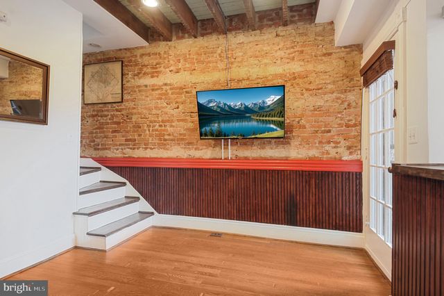 a view of an entryway with wooden floor