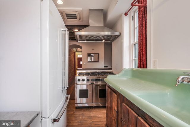 a kitchen with a stove and a microwave