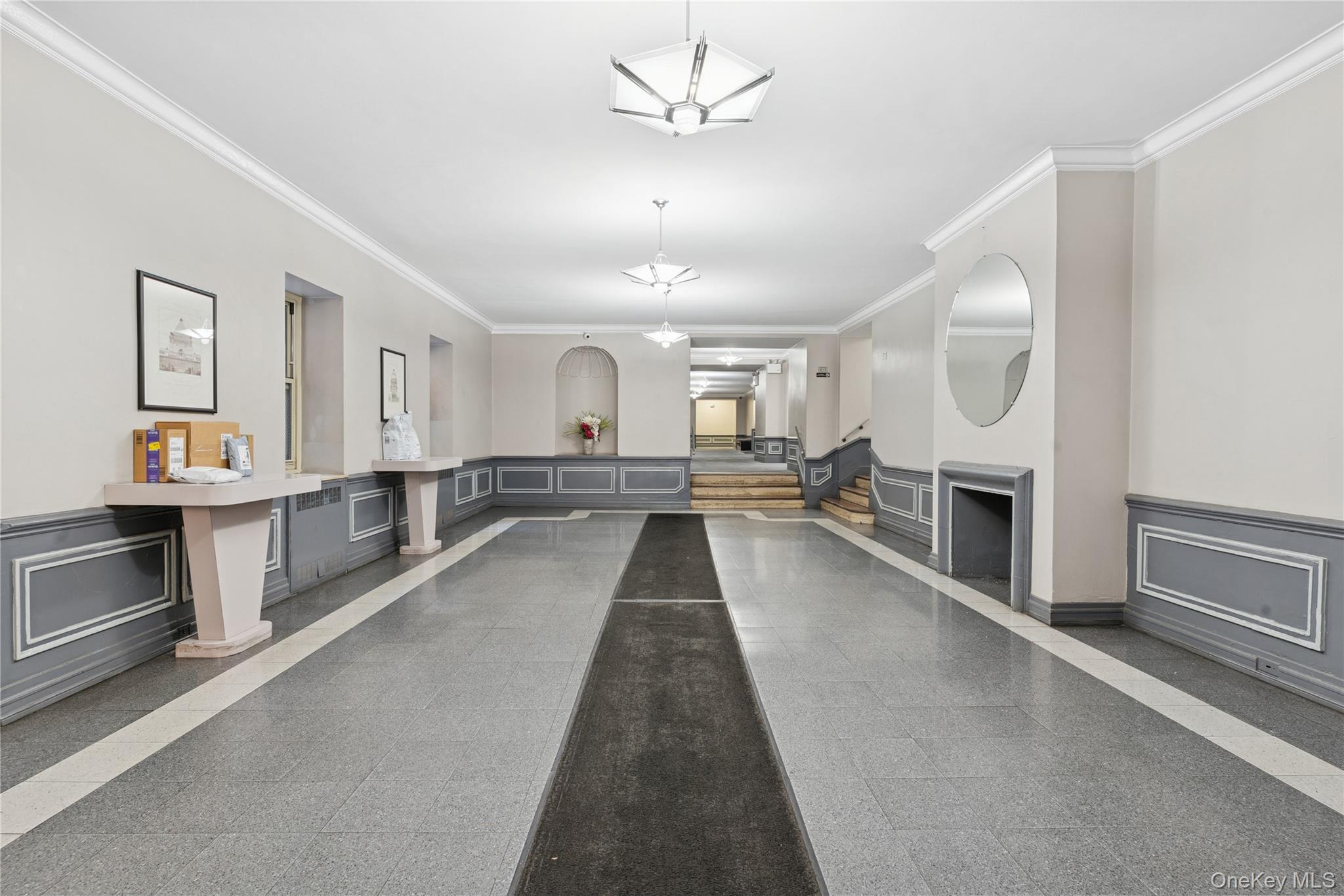 110-31 73rd Road, Unit 5N Queens, NY 11375 - Photo 12 of 13 Garage featuring a decorative wall and a wainscoted wall