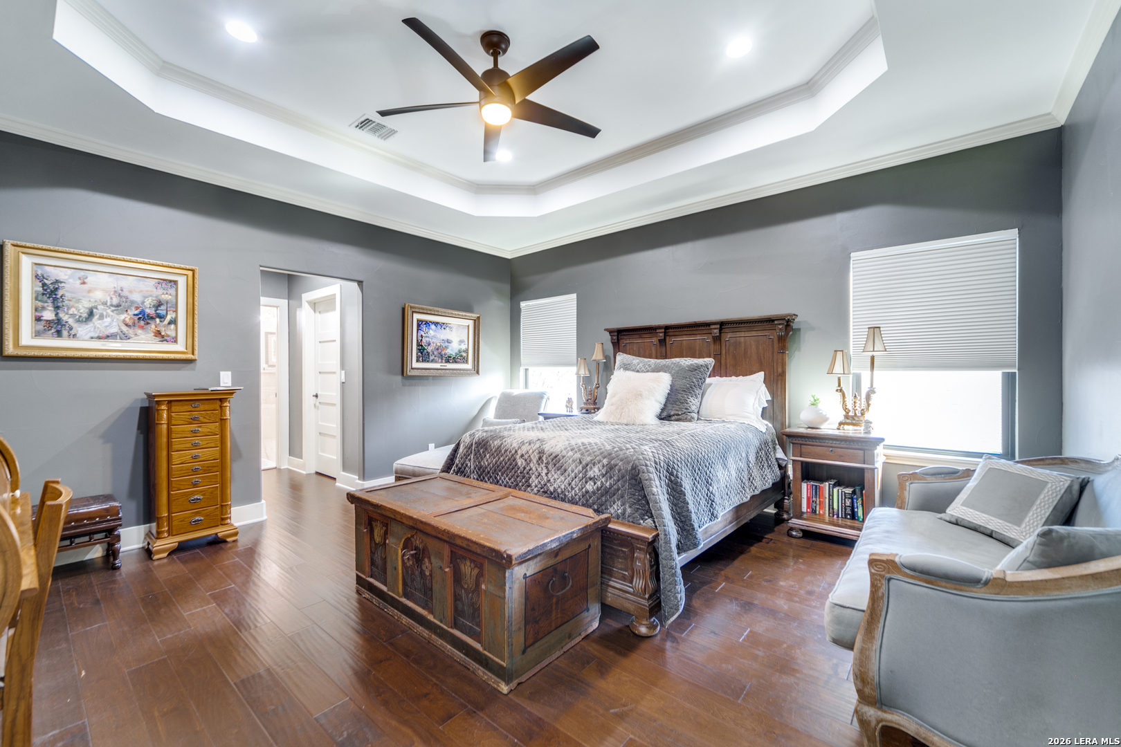 313 James Street Boerne, TX 78006 - Photo 16 of 27 a bedroom with a large bed a flat screen tv and couches