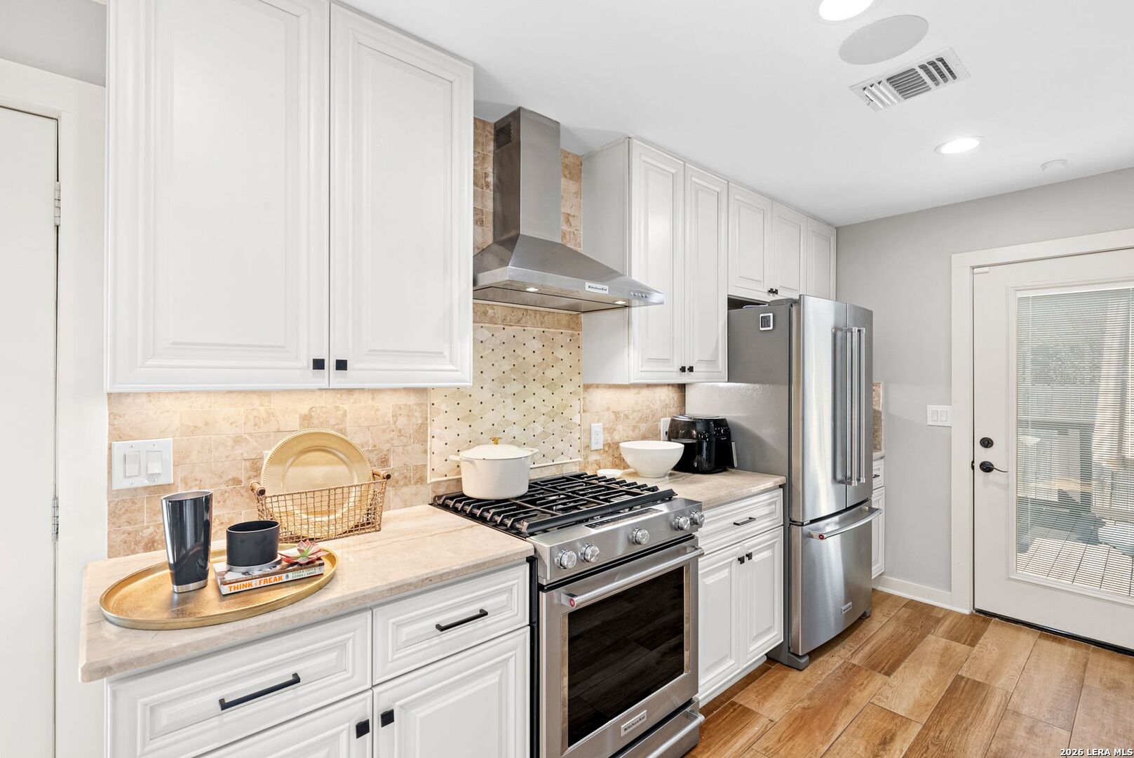 313 James Street Boerne, TX 78006 - Photo 5 of 27 a kitchen with stainless steel appliances granite countertop a refrigerator stove and sink