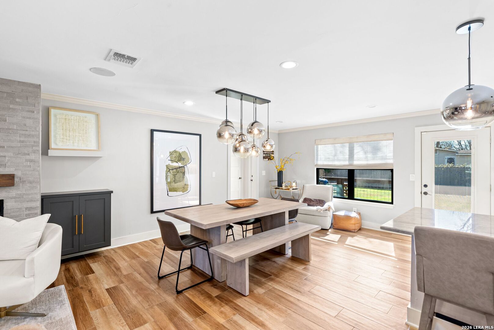 313 James Street Boerne, TX 78006 - Photo 7 of 27 a living room with furniture a wooden floor and a chandelier