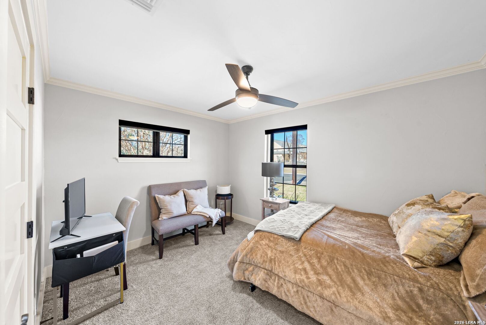 313 James Street Boerne, TX 78006 - Photo 8 of 27 a bedroom with a bed and a chandelier