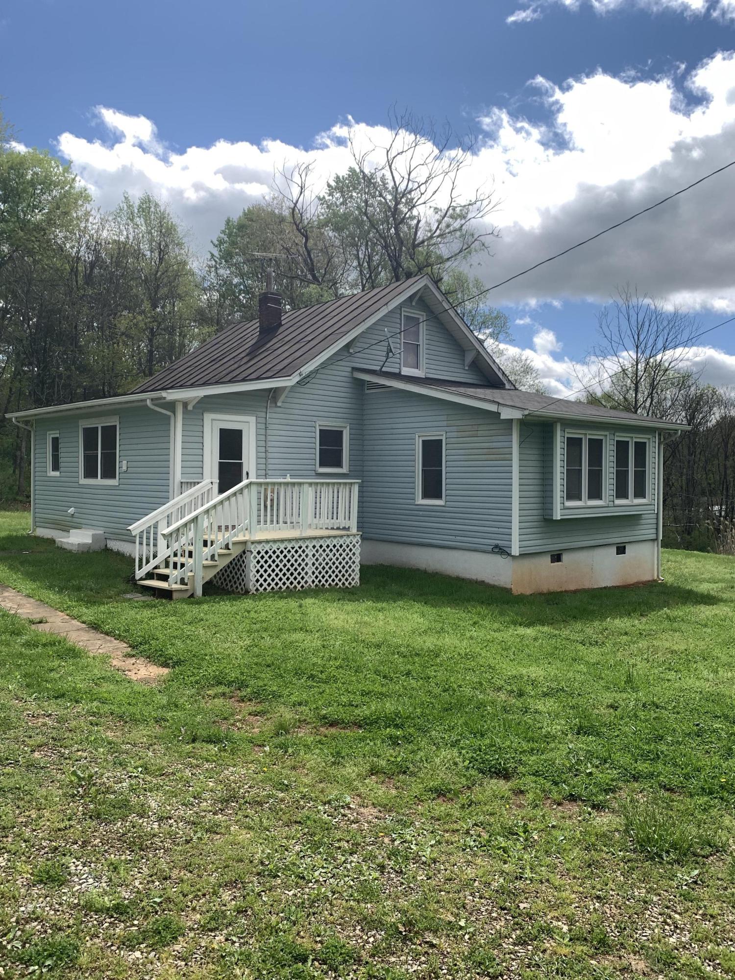 85 Old Ferrum Road Ferrum, VA 24088 - Photo 14 of 60 a view of a house with backyard and garden