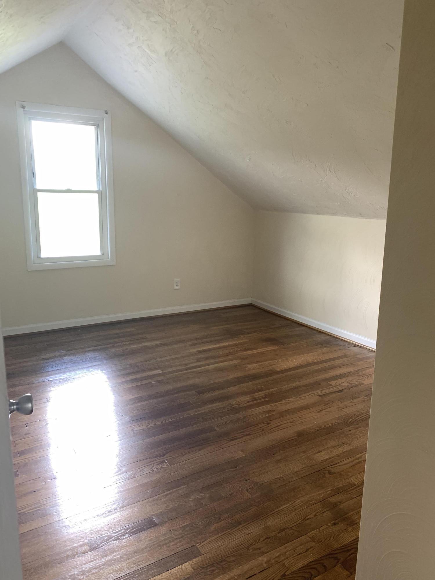 85 Old Ferrum Road Ferrum, VA 24088 - Photo 22 of 60 an empty room with wooden floor and windows