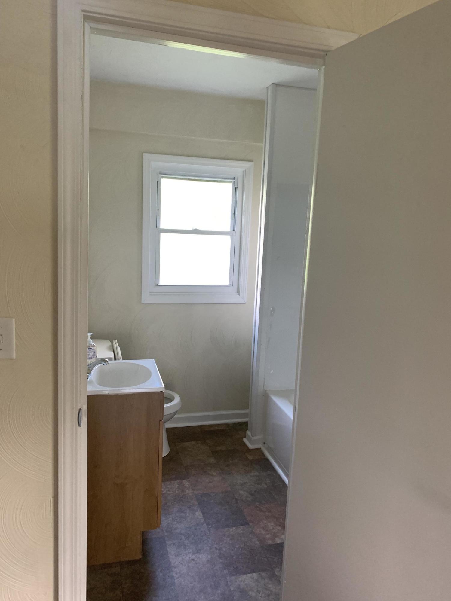 85 Old Ferrum Road Ferrum, VA 24088 - Photo 29 of 60 a bathroom with a sink and mirror with toilet