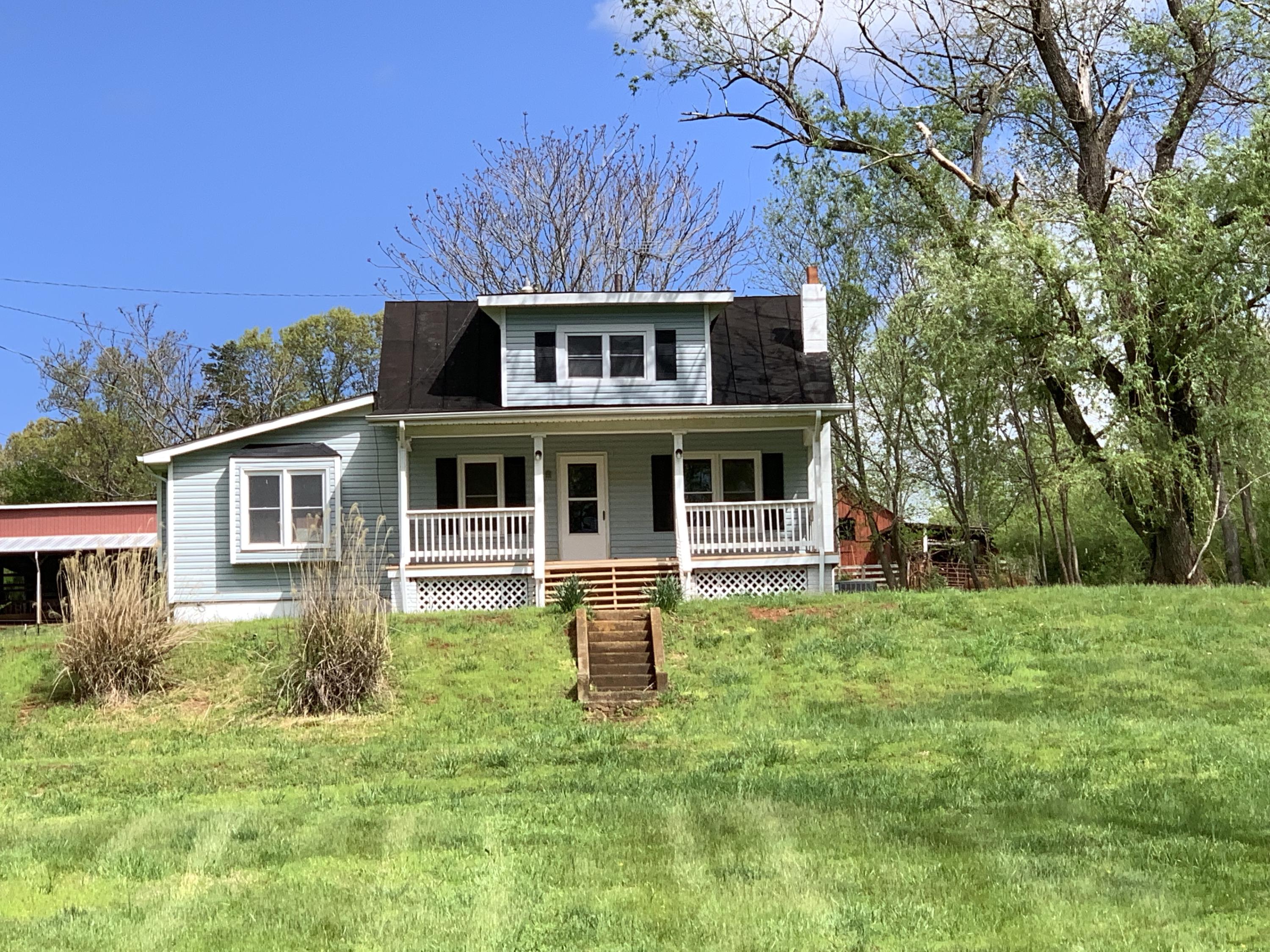 85 Old Ferrum Road Ferrum, VA 24088 - Photo 4 of 60 a front view of a house with a garden