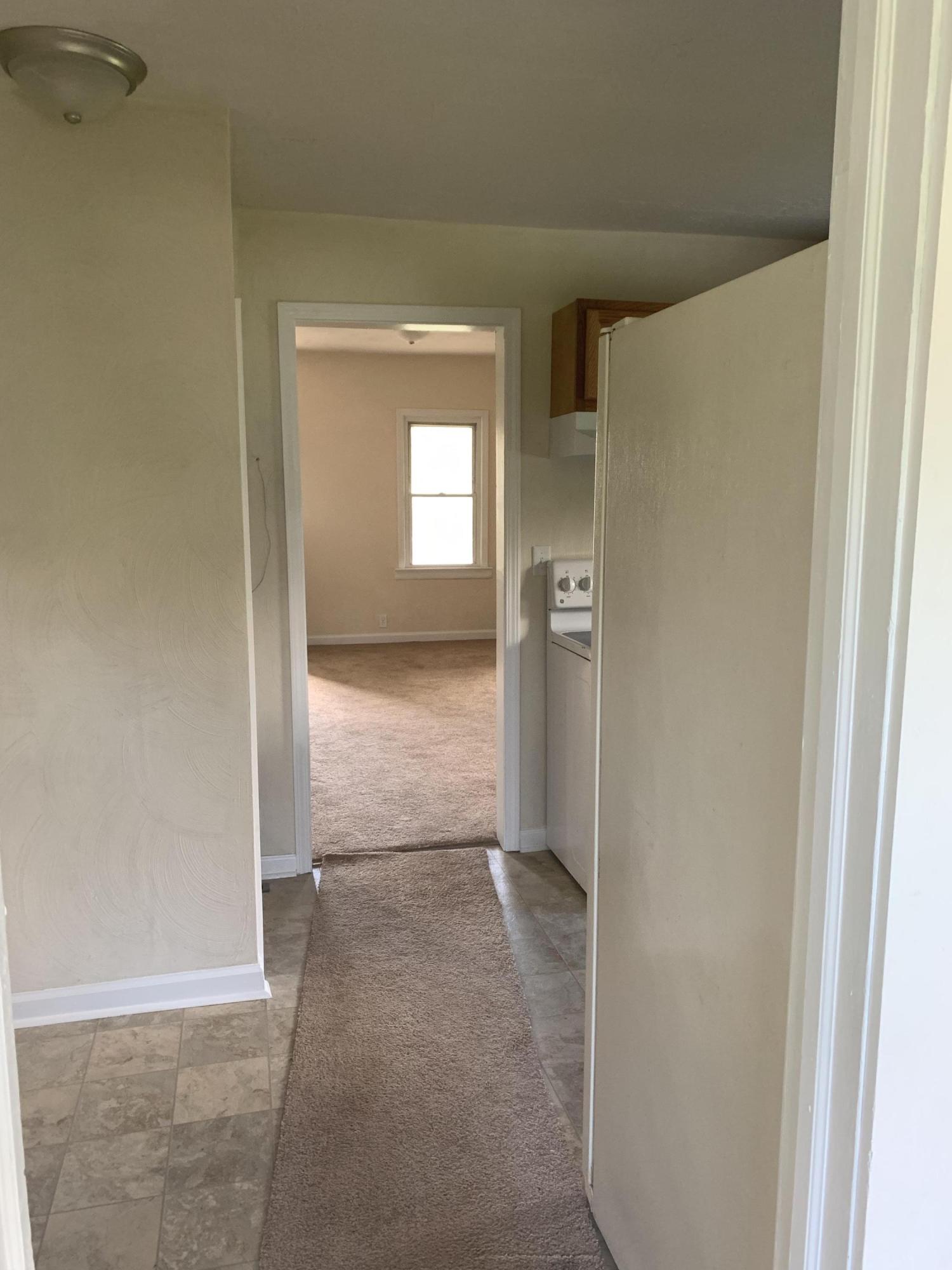 85 Old Ferrum Road Ferrum, VA 24088 - Photo 34 of 60 a view of a hallway with wooden floor and a livingroom