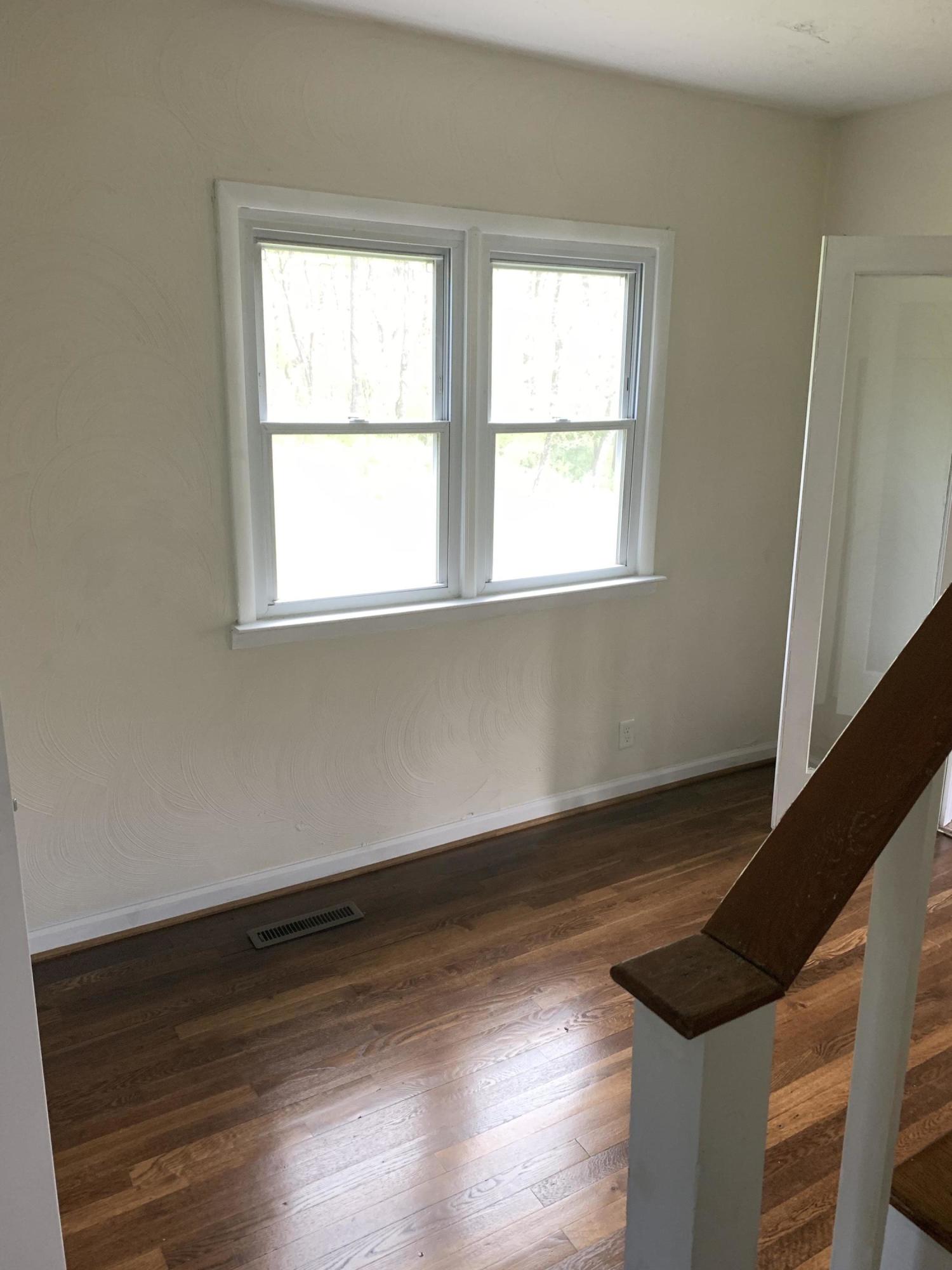 85 Old Ferrum Road Ferrum, VA 24088 - Photo 57 of 60 an empty room with wooden floor and windows