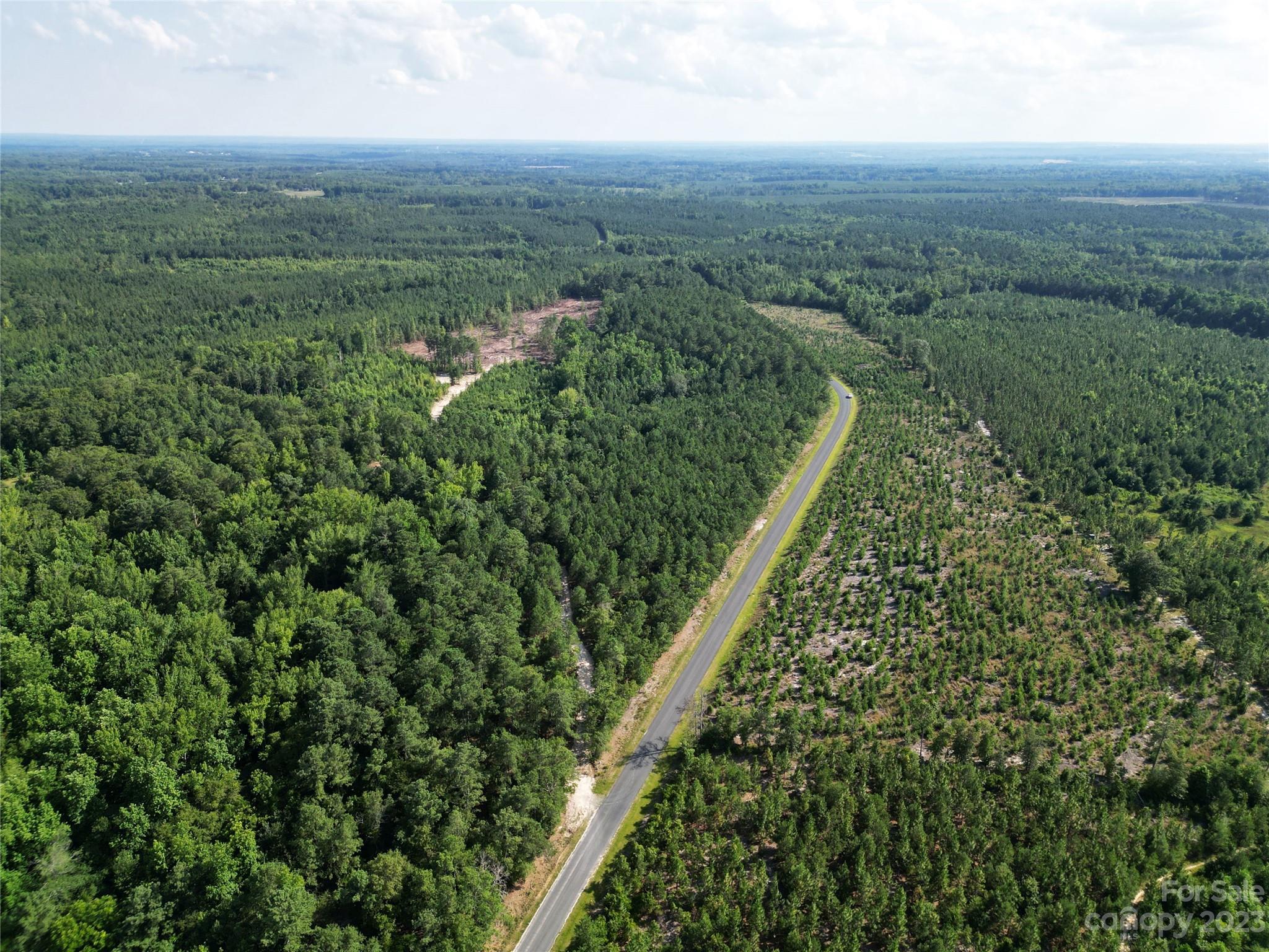 Tbd Hightower Road Morven, NC 28119 - Photo 16 of 20 an aerial view of residential houses with outdoor space and trees