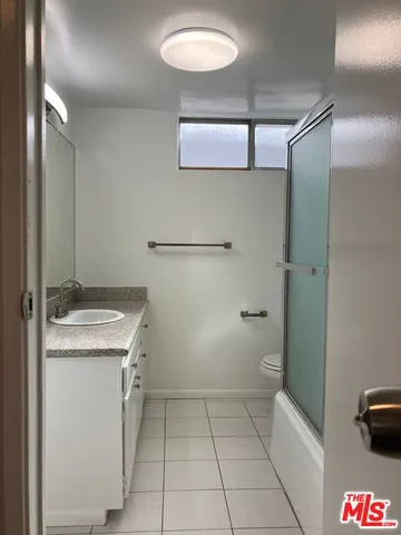 a view of hallway with wooden floor