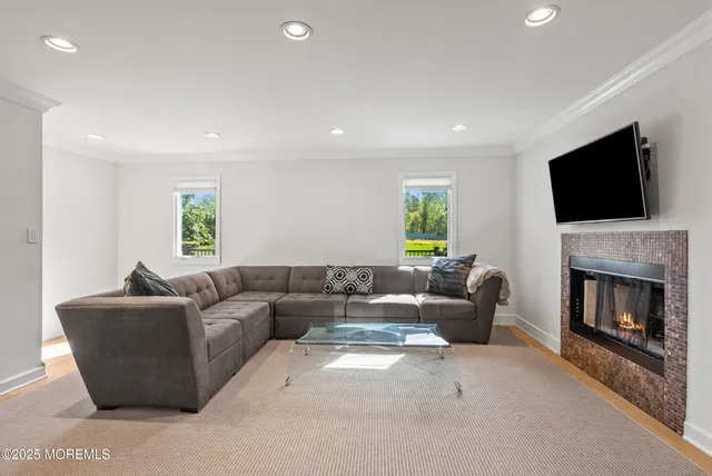a utility room with cabinets washer and dryer
