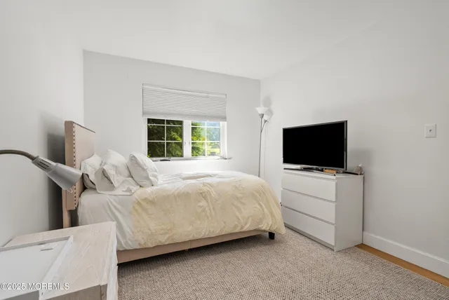 a aerial view of a house with swimming pool and sitting area
