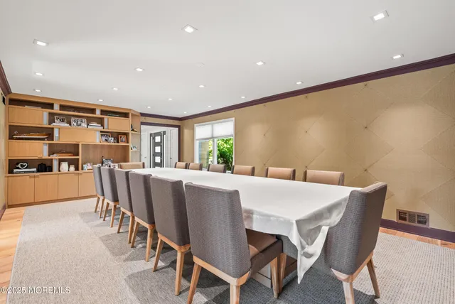 a living room with furniture and a rug