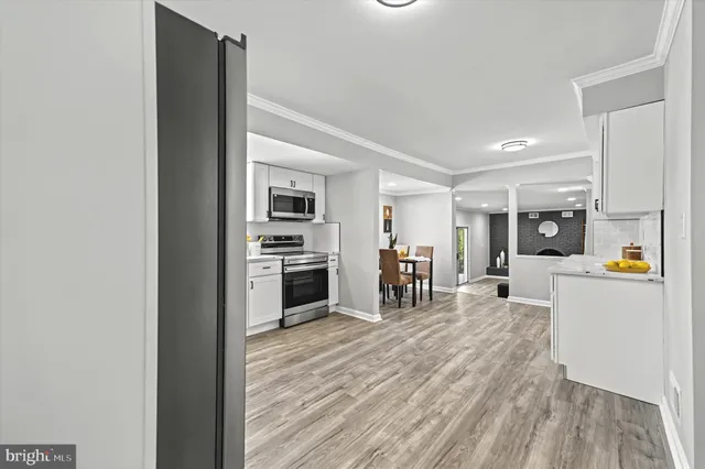 a kitchen with stainless steel appliances a refrigerator and a stove