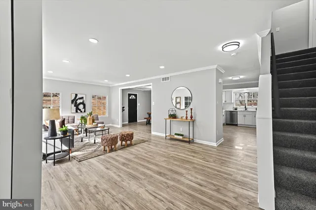 a view of a living room and entry way