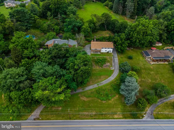 a view of a swimming pool with a yard