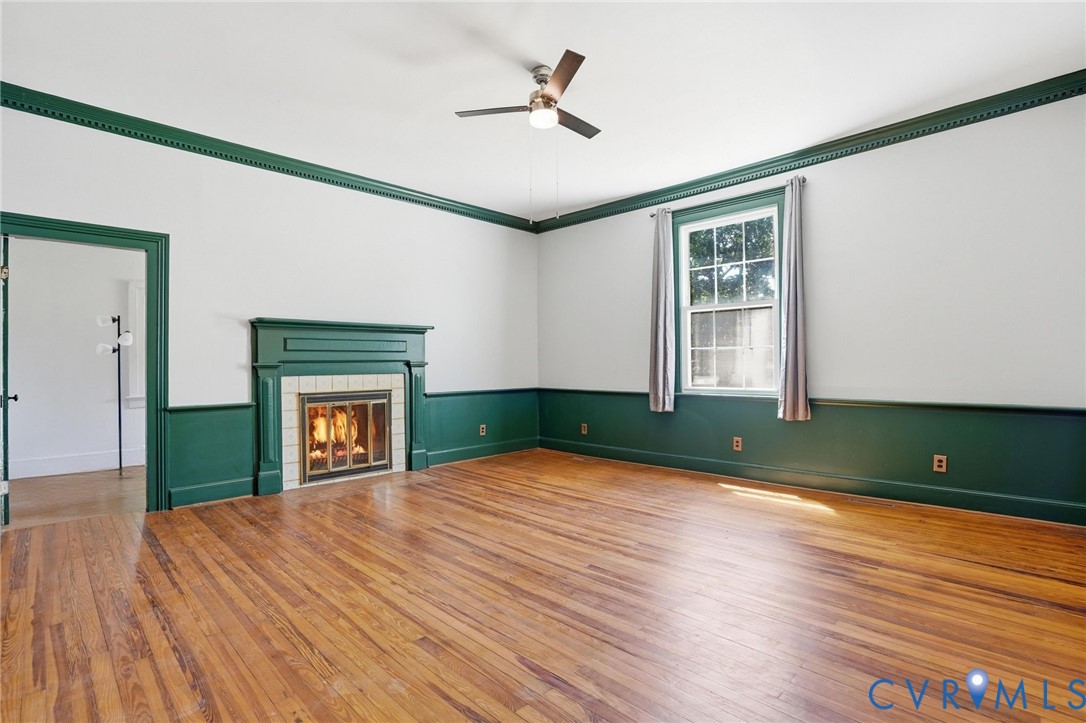 2297 Indian Oak Road Crewe, VA 23930 - Photo 34 of 53 a view of livingroom with hardwood floor and a ceiling fan