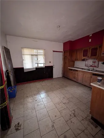 a kitchen with stainless steel appliances a stove a sink and a refrigerator