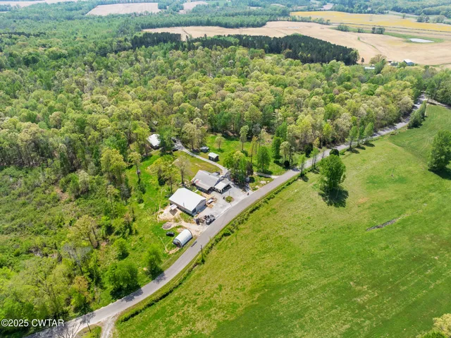 a kitchen with a sink appliances cabinets and a window