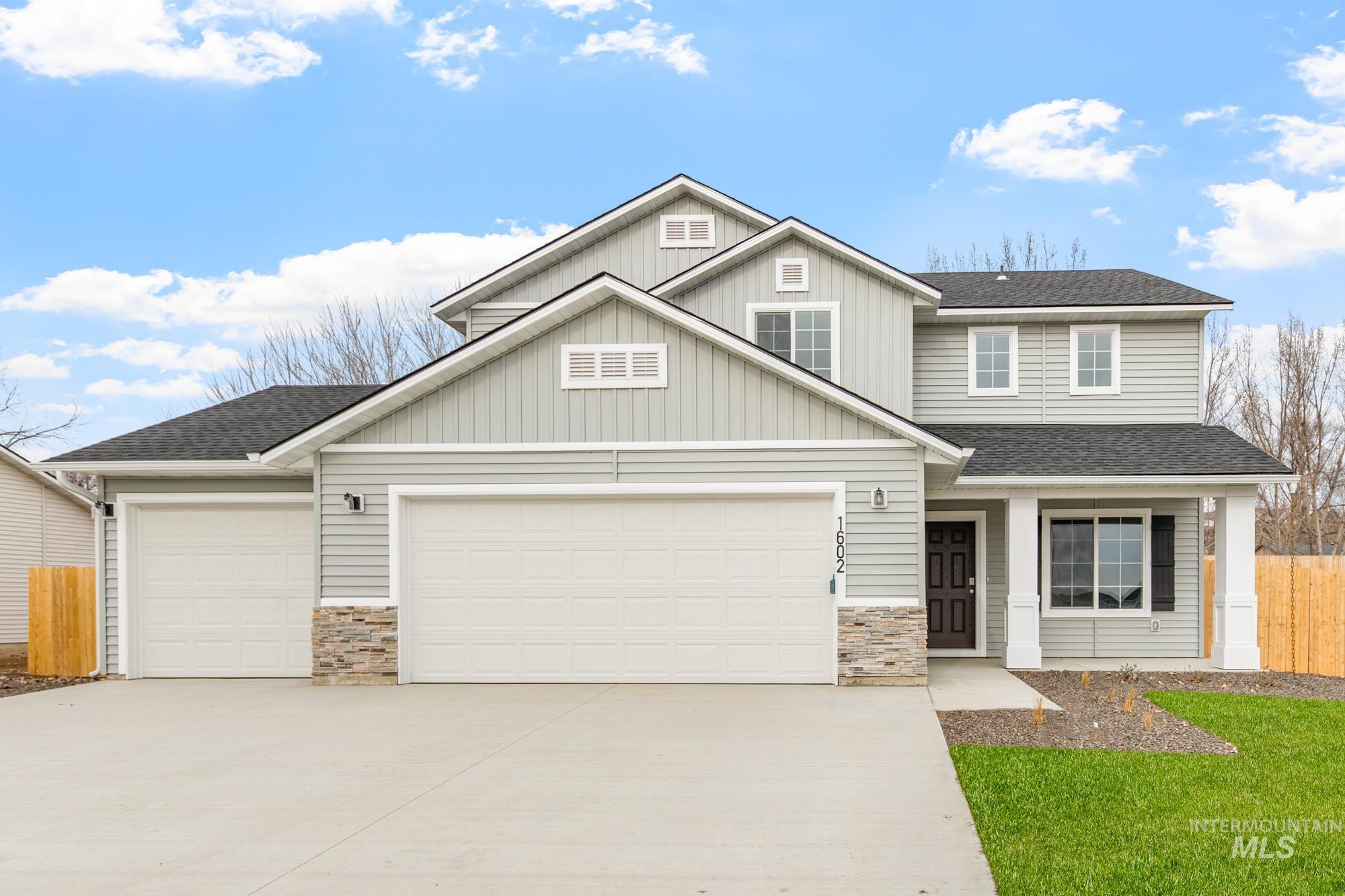 1602 Long Pond Street Middleton, ID 83644 - Photo 1 of 1 Craftsman house with a shingled roof, stone siding, board and batten siding, and driveway