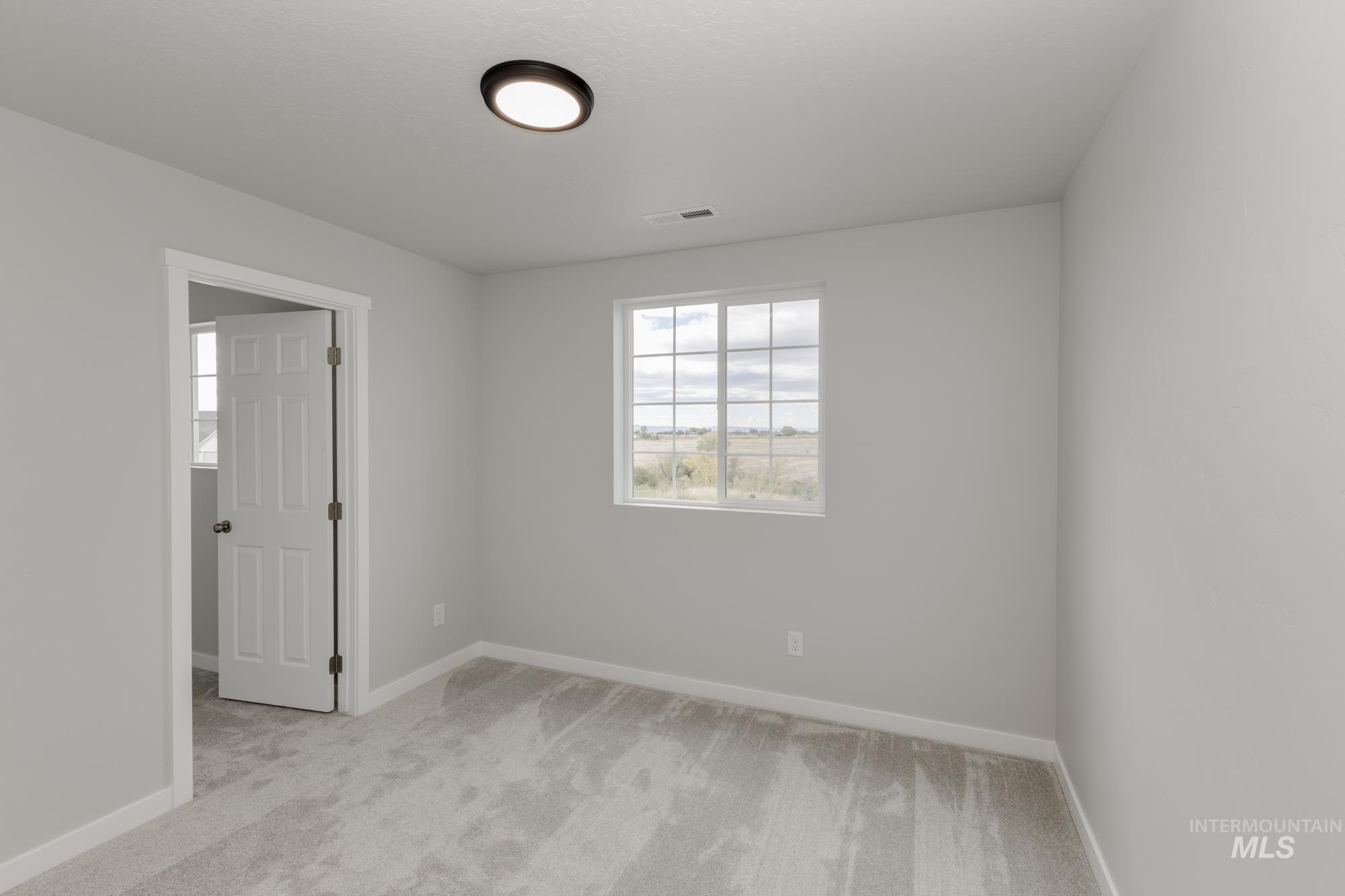 1602 Long Pond Street Middleton, ID 83644 - Photo 11 of 20 Unfurnished room with light carpet