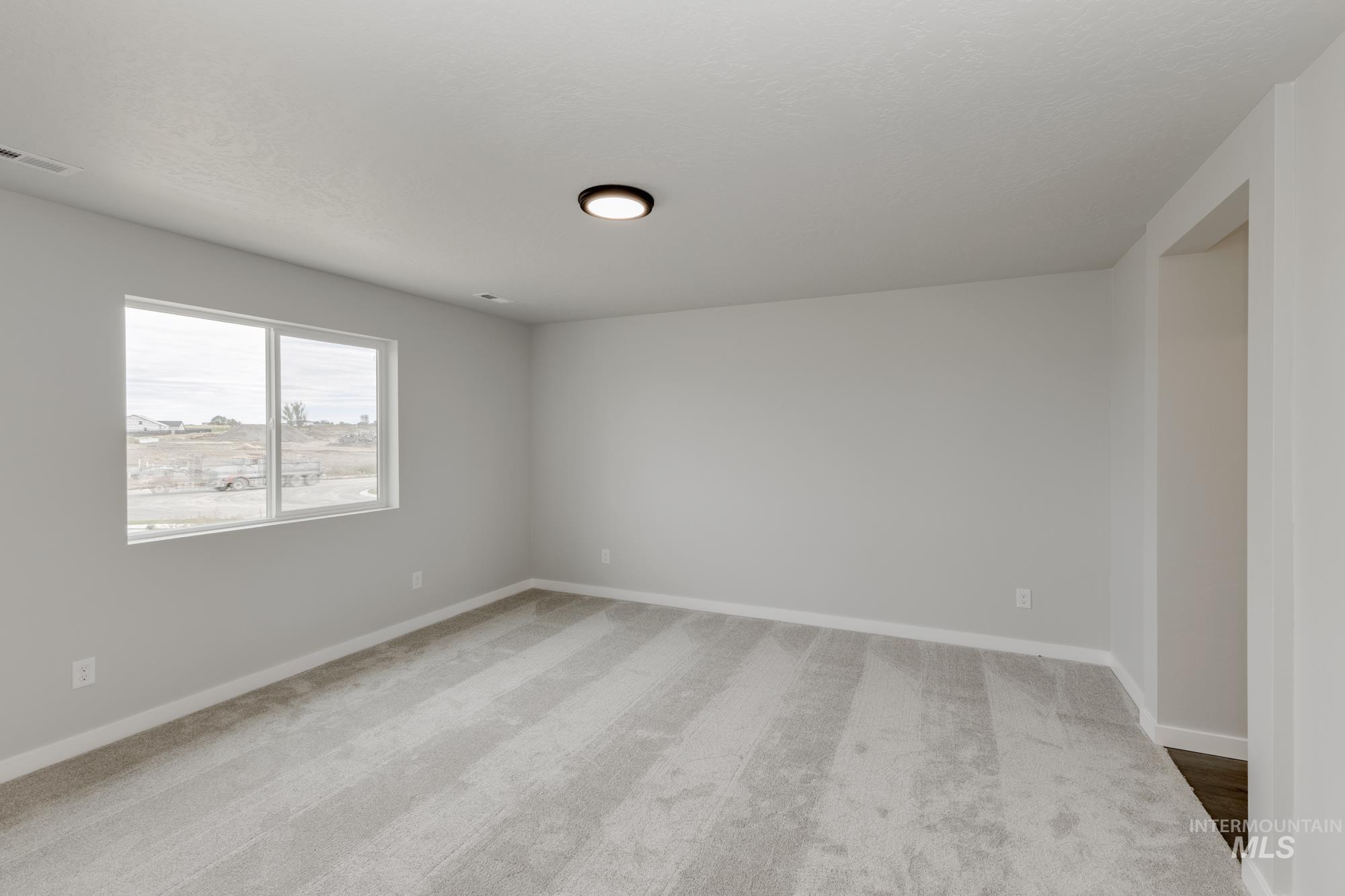 1602 Long Pond Street Middleton, ID 83644 - Photo 16 of 20 Spare room with baseboards and light carpet