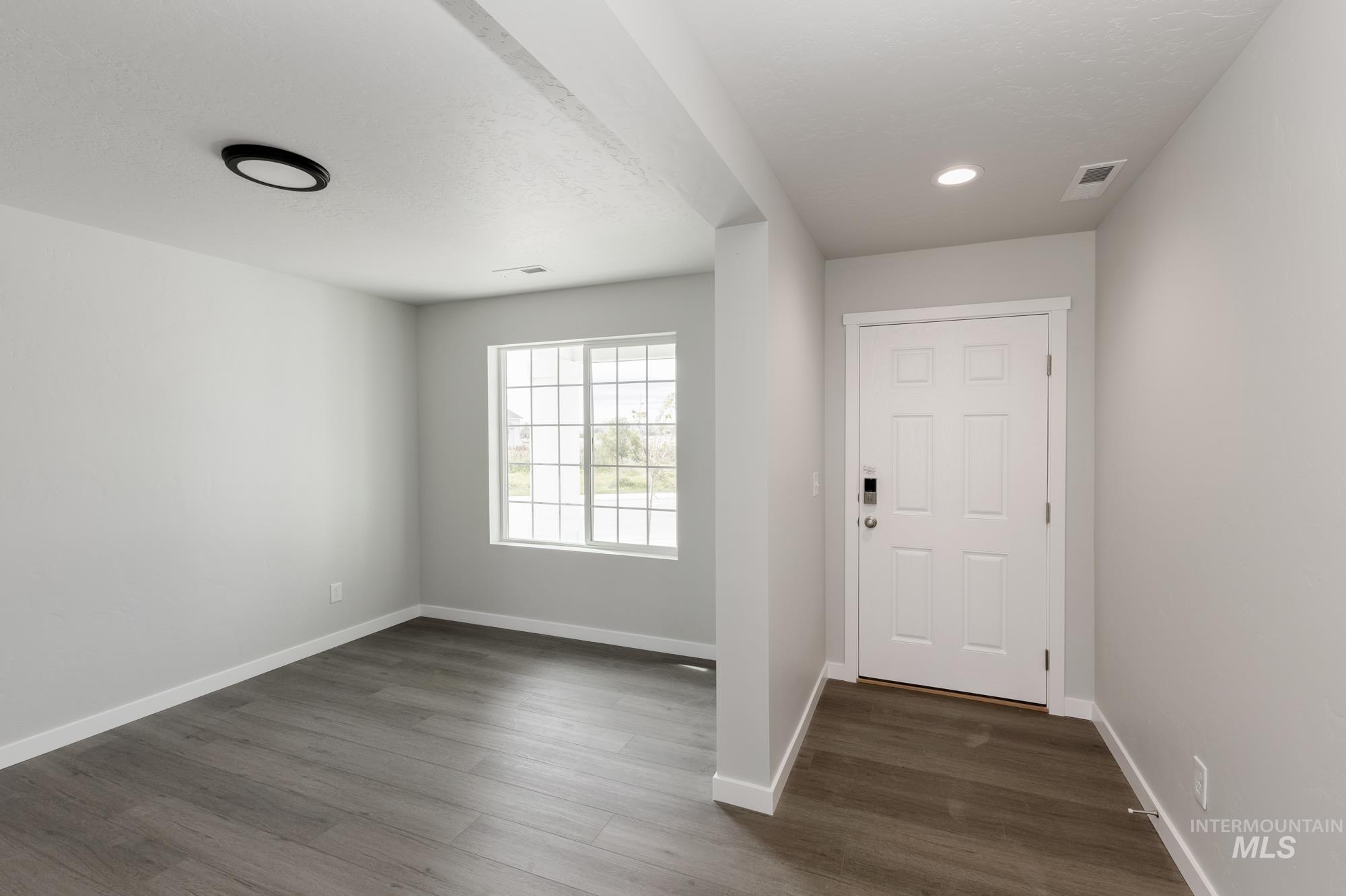 1602 Long Pond Street Middleton, ID 83644 - Photo 2 of 20 Foyer entrance featuring dark wood finished floors and recessed lighting