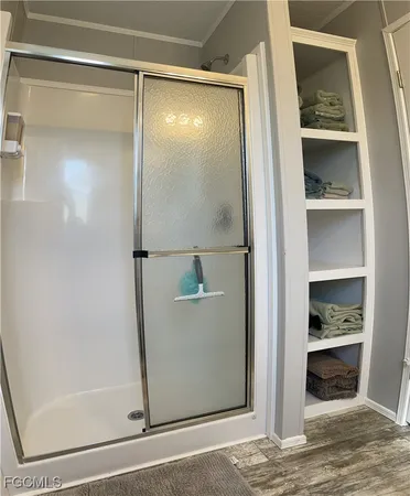 a bedroom with a flat tv and a bed